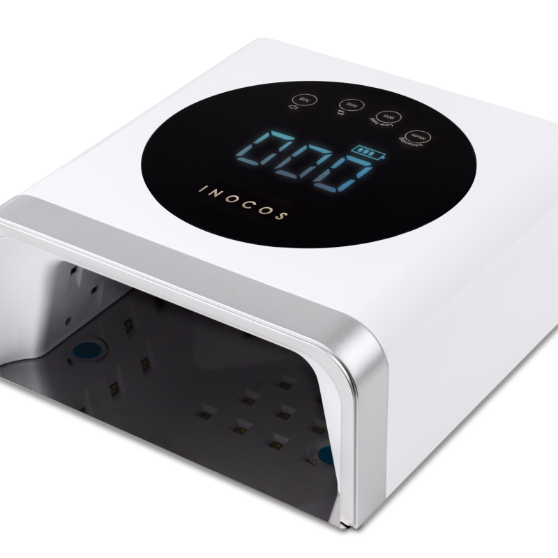 Lamp Care Portable com Luz Vermelha REF. 93.04.023 Apresentamos-te a Lamp Care Portable INOCOS. Esta Lâmpada é portátil com uma autonomia até 6 horas. A Luz Vermelha ajuda a reverter sinais da idade da pele, manchas, vermelhidão e cicatrizes. Funções: Luz Violeta: Catalisação Luz Rosa: Catalisação e Pele Cuidada Luz Vermelha: Pele Cuidada Características: Base Amovível - Pedicure mais prática Encaixe fácil de íman 360º Luz LED/UV - Zero ângulos mortos Painel Touch