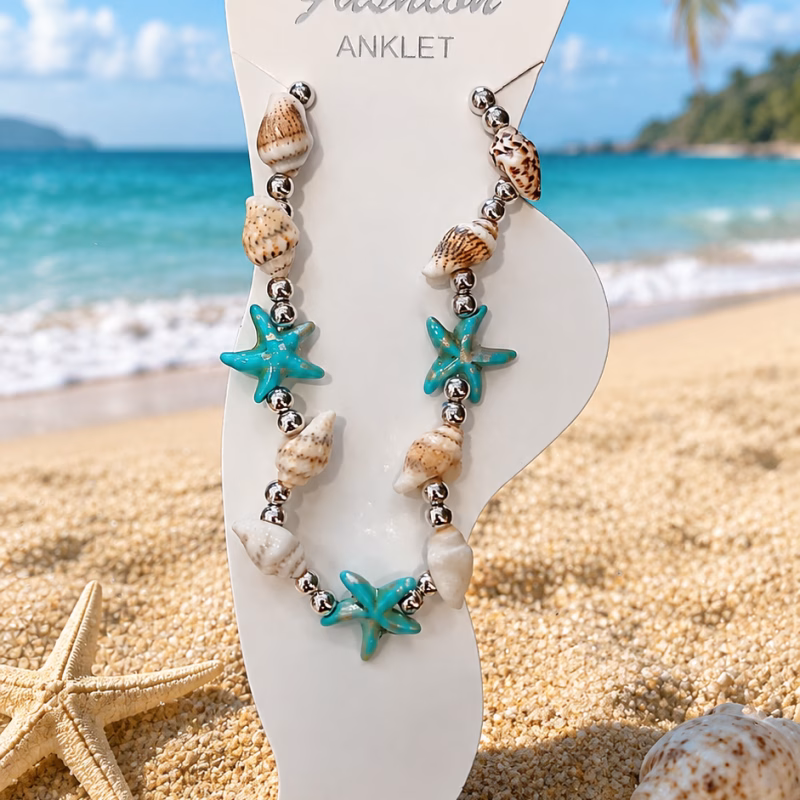 Bijuteria – Pulseira de Pé Azul Esta tornozeleira de praia com conchas e estrelas-do-mar turquesa apresenta um estilo boho e costa, ideal para os dias de verão Cor Azul Outras cores disponiveis